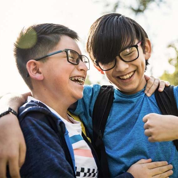 Two boys laughing together